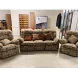 A MODERN THREE PIECE SUITE COMPRISING THREE SEATER RECLINING SOFA AND TWO ARMCHAIRS IN FLORAL