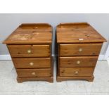 A PAIR OF PINE BEDSIDE CUPBOARDS WITH BRASS HANDLES 47 X 61 X 44.5CM