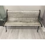 A CAST METAL AND TEAK GARDEN BENCH