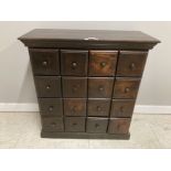 A STAINED WOOD 16 DRAWER CABINET WITH TURNED WOODEN HANDLES 81 X 86 X 34.5CM