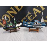2 PAINTED MODEL BOATS ON STANDS