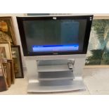 A PANASONIC VIETA 36IN TV ON STAND WITH REMOTE