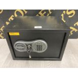AN ELECTRIC COMBINATION SAFE WITH KEY AND WALL FITTINGS