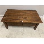 A HEAVY SOLID OAK RECTANGULAR COFFEE TABLE WITH TWO DRAWERS 130 X 48 X 76CM