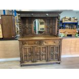 AN OAK DRESSER BY COUNTRY FORM WITH BEVELLED MIRROR BACK FLANKED BY BARLEY TWIST SUPPORTS TWO