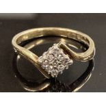 9CT YELLOW GOLD AND DIAMOND CLUSTER RING COMPRISING OF A SQUARE SHAPE OF NINE ROUND CUT DIAMONDS