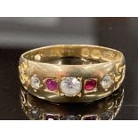 A 15CT YELLOW GOLD RUBY AND WHITE STONE BAND COMPRISING OF TWO ROUND CUT RUBIES COMPLETE WITH