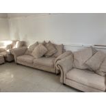 A MODERN THREE PIECE SUITE COMPRISING A LARGE TWO SEATER 245CM WIDE AN ARMCHAIR WITH FOOTSTOOL AND A