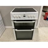 A BEKO ELECTRIC OVEN IN WHITE