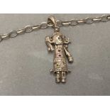 A SILVER RAG DOLL PENDANT SET WITH STONES ON A SILVER LINK CHAIN 11.7G GROSS