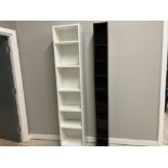 A FLAT PACK WHITE BOOKCASE AND A BLACK CD RACK