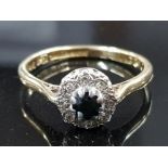 18CT GOLD RING WITH CENTRAL SAPPHIRE AND SURROUNDING DIAMONDS 3.2G GROSS SIZE P 1/2