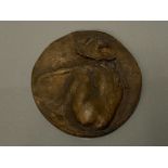 BRONZE PLAQUE 5 X 4 3/4IN OF A NUDE YOUNG WOMAN PICTURED FROM BEHIND AND WEARING A HAT BY