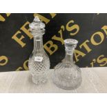 A WATERFORD CRYSTAL DECANTER AND STOPPER TOGETHER WITH A CUT CRYSTAL STEPPED SHIP’S DECANTER AND
