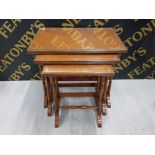 A NEST OF 3 MAHOGANY FRAMED TABLES WITH LEATHER AND GLASS TOPS