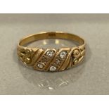 9CT GOLD DIAMOND COMPRISING OF 6 ROUND BRILLIANT CUT STONES SIZE N1/2 1.9G