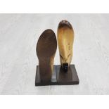 A PAIR OF ARTHUR BOOKENDS IN THE FORM OF SHOE LASTS