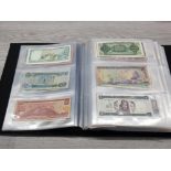 AN ALBUM CONTAINING MISCELLANEOUS WORLDWIDE BANKNOTES INCLUDES BANQUE DU LIBAN STATE OF ERITREA