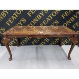 A CARVED MAHOGANY GLASS TOPPED RECTANGULAR SHAPED COFFEE TABLE 96CM X 44CM