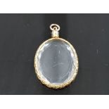 18CT LOCKET PENDANT WITH ENGRAVED EDGING GROSS WEIGHT 4.3G