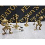 PAIR OF SOLID BRASS FIRE DOGS WITH BALL AND CLAW DESIGN, WITH A PAIR OF BRASS HONEYCOMB CANDLESTICKS