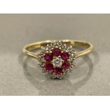 9CT GOLD RUBY AND DIAMOND CLUSTER RING SIZE J 1.6G