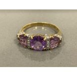 9CT GOLD AMETHYST AND DIAMOND THREE STONE RING SIZE N1/2 2.7G