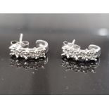 9CT WHITE GOLD DIAMOND 1/2 HOOP EARRINGS FEATURING 4 CLAW SET DIAMONDS COMPLETE WITH BUTTERFLY BACKS