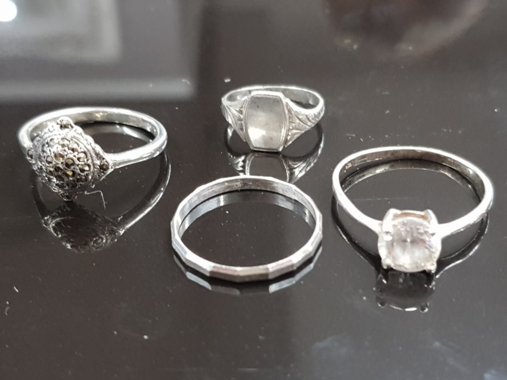 4 SILVER RINGS 1 DECORATED SINGLE WHITESTONE 1 MARCASITE AND 2 PLAIN 5.7 GRAMS GROSS