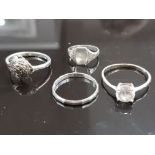 4 SILVER RINGS 1 DECORATED SINGLE WHITESTONE 1 MARCASITE AND 2 PLAIN 5.7 GRAMS GROSS