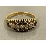 15CT GOLD GARNET AND PEARL CLUSTER RING WITH CLAW SETTING