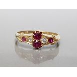 18CT YELLOW GOLD LADIES RUBY AND DIAMOND ORNATE RING FEATURING 4 BRILLIANT ROUND CUT RUBY'S AND A