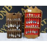 24 CRESTED SPOONS FROM AROUND THE WORLD BOTH ON WOODEN WALL RACKS