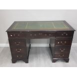 A REPRODUCTION MAHOGANY LEATHER TOPPED DESK