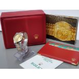 ROLEX LADIES 26MM ROLEX DATEJUST YELLOW GOLD AND STAINLESS STEEL CHAMPAGNE DIAL WITH GOLD BATON