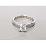 18CT WHITE GOLD LADIES DIAMOND SOLITAIRE RING COMPRISING OF A BRILLIANT ROUND CUT DIAMOND SET IN 4