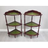 A PAIR OF REPRODUCTION MAHOGANY LEATHERED TOPPED WHAT NOT STANDS