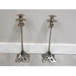 ARTS AND CRAFTS STYLE PAIR OF CAST AND POLISHED WHITE METAL CANDLESTICKS