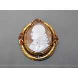 YELLOW GOLD CAMEO BROOCH WITH GENTS HEAD SET IN THE CAMEO WITH CORAL BEADS SET AT THE TOP AND