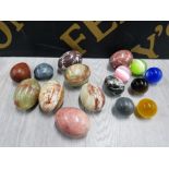 MARBLE AND ONYX EGGS TOGETHER WITH GLASS BALLS POSSIBLY LARGE MARBLES