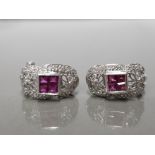 18CT WHITE GOLD RUBY AND DIAMOND CULF EARRING FEATURING 4 PRINCESS CUT RUBY'S SET IN THE CENTRE WITH