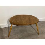 BLONDE ERCOL PEBBLE SHAPED SMALL TABLE 65CM BY 43CM BY 40CM