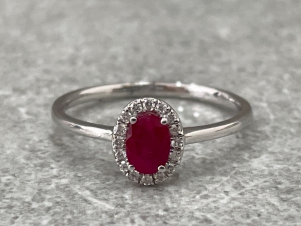 18CT WHITE GOLD RUBY AND DIAMOND RING .60CTS SIZE O 1.7G