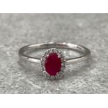 18CT WHITE GOLD RUBY AND DIAMOND RING .60CTS SIZE O 1.7G