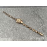 9CT GOLD ACCURIST LADIES WATCH ON 9CT GOLD FLORAL LINK BRACELET 11.6G IN WORKING ORDER