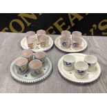 4 HAND PAINTED POOLE POTTERY EGG CUP PLATES WITH EGG CUPS 1 CUP MISSING