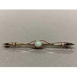 15CT YELLOW GOLD OPAL AND PEARL ORNATE BROOCH COMPRISING OF AN OVAL CUT OPAL IN THE CENTRE SET