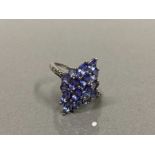 SILVER TANZANITE 17 STONE CLUSTER RING WITH 4 DIAMOND SET SHOULDERS SIZE N 3.5G GROSS