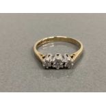 9CT YELLOW GOLD THREE STONE DIAMOND RING COMPRISING OF THREE BRILLIANT ROUND CUT DIAMONDS SET IN