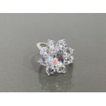 LADIES SILVER STONE SET FLOWER RING FEATURING CUBIC ZIRCONIAS SET IN THE SHAPE OF A FLOWER ALL